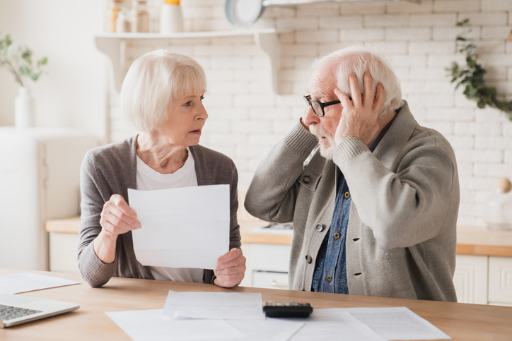 A senior couple reviewing their retirement plan.
