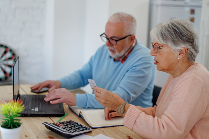 A senior couple checking their retirement benefits.