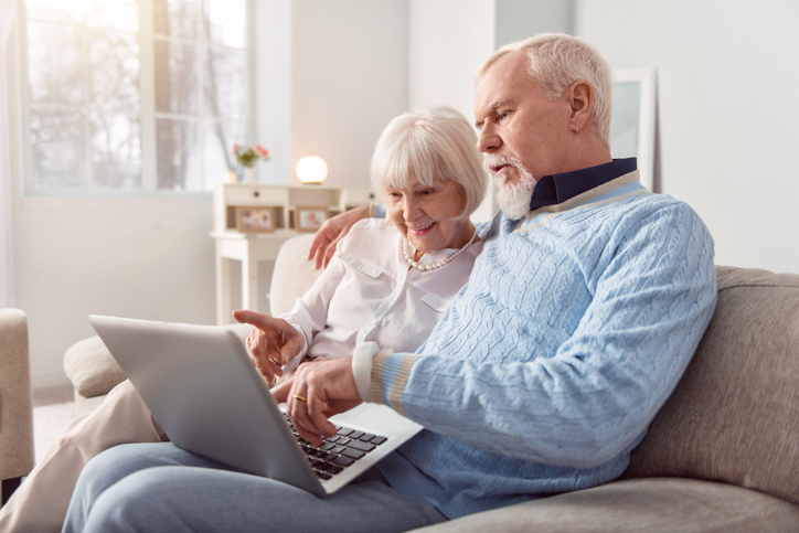 A senior couple rebalancing their retirement plan.